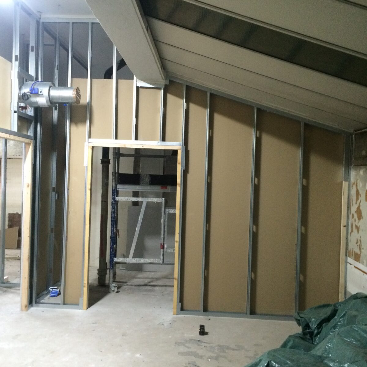 Empty hall before partitioning, looking down the length of the room